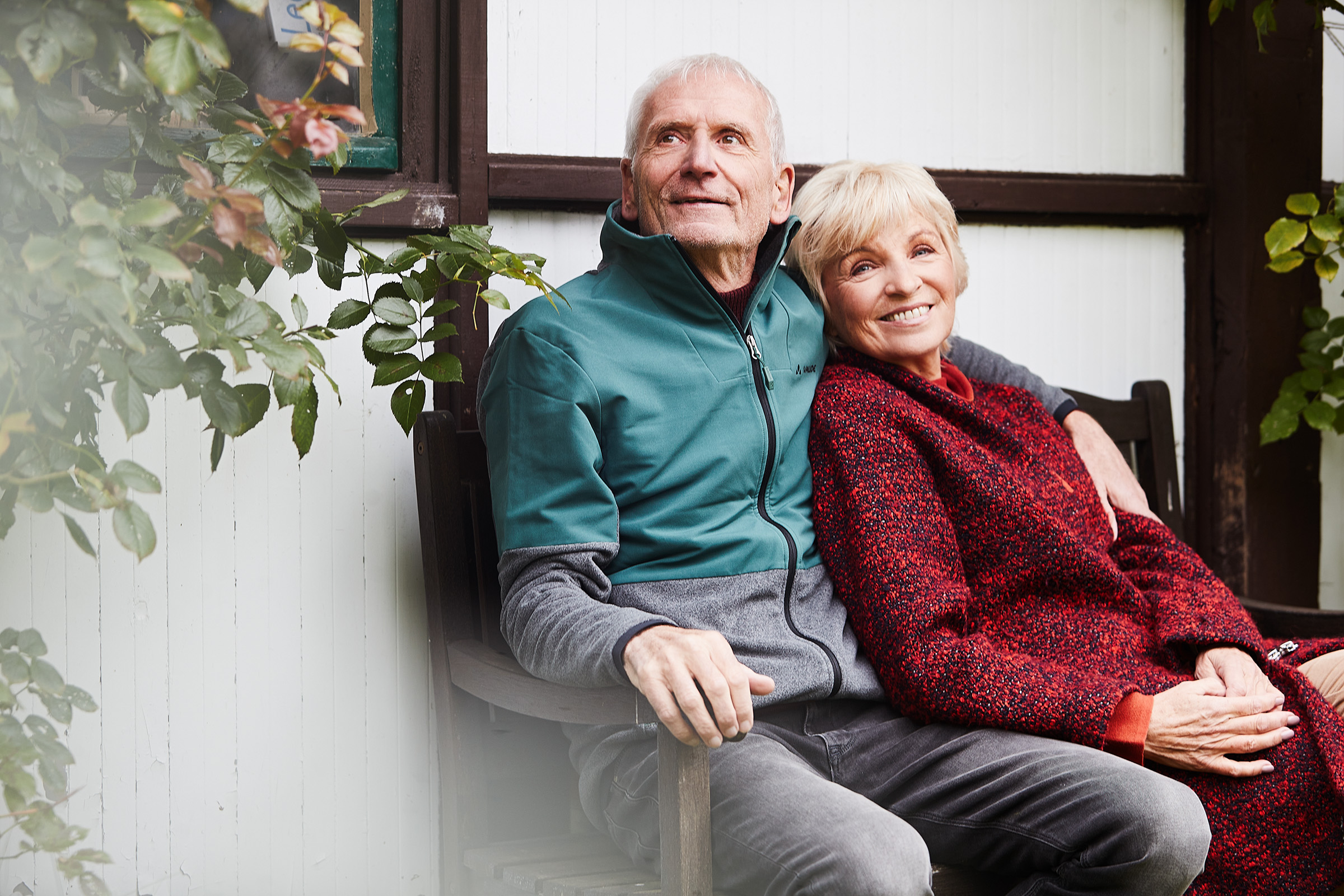 elderly people sitting on a bench