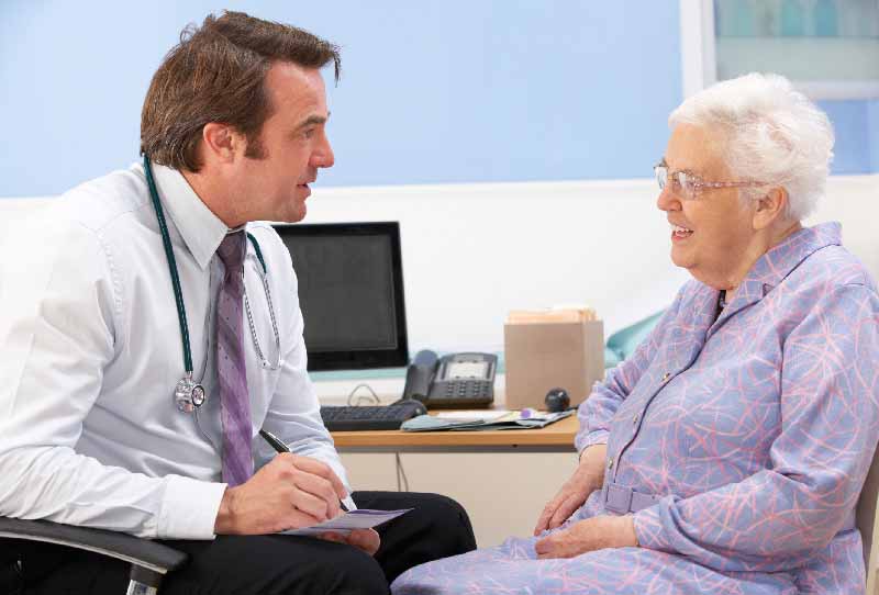Doctor advising older patient